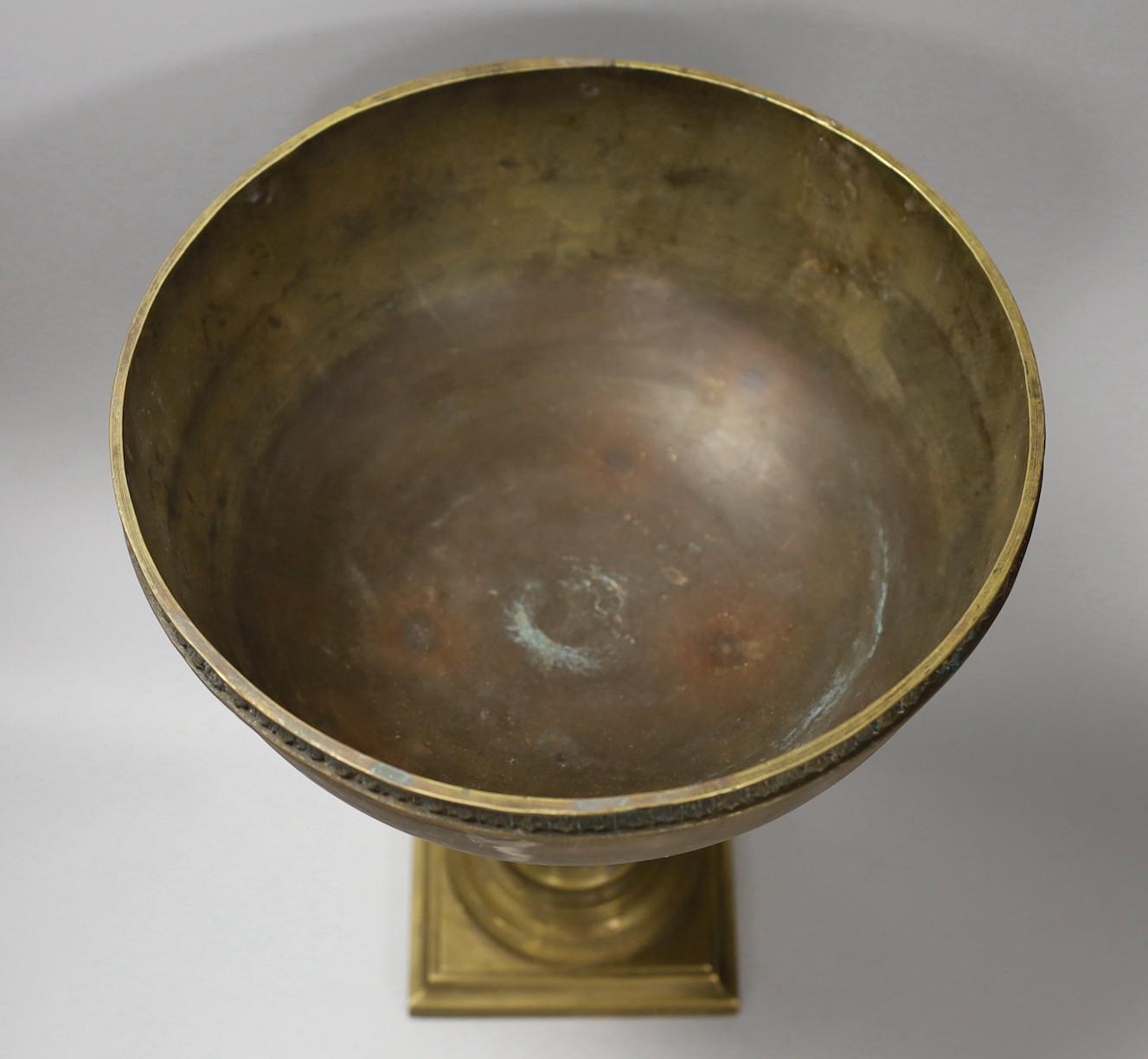 A brass bowl with Ionic column stand, 30cm high